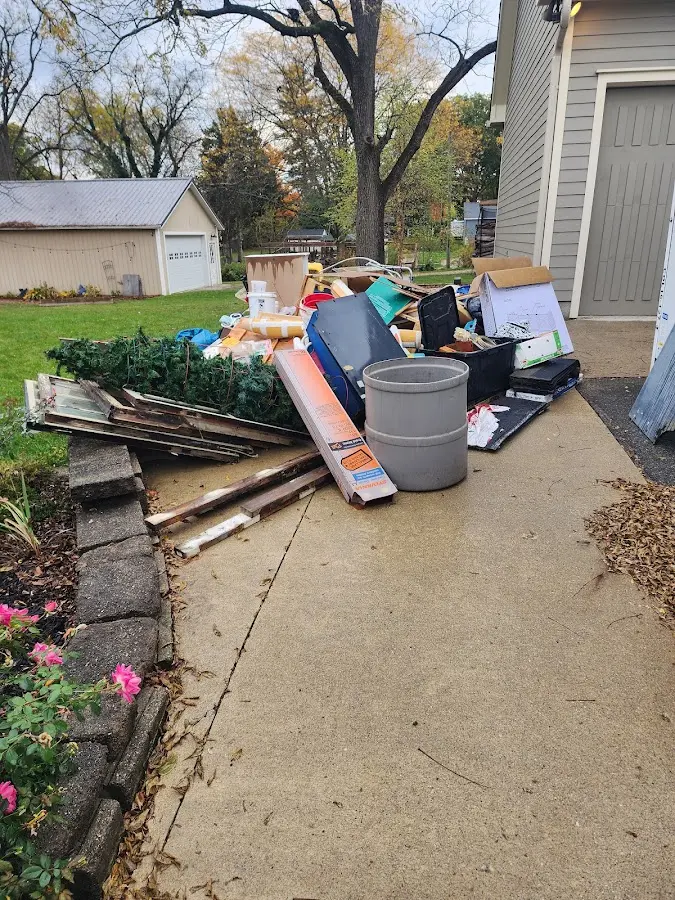 Dumpster being loaded with debris for Residential Dumpster Rental in Gloucester Courthouse
